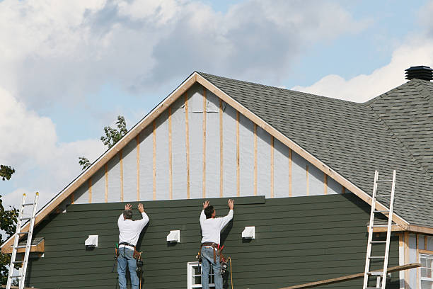 Professional Storm Damage Siding Repair technician working in Belle Plaine, MN